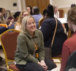 Image of staff talking at Peer Community Gathering