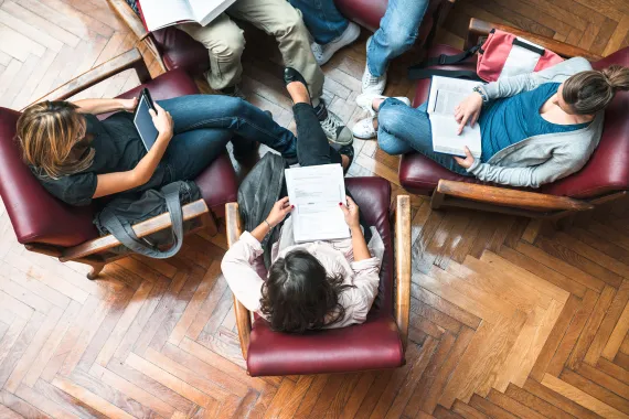 Group of people in a circle of chairs